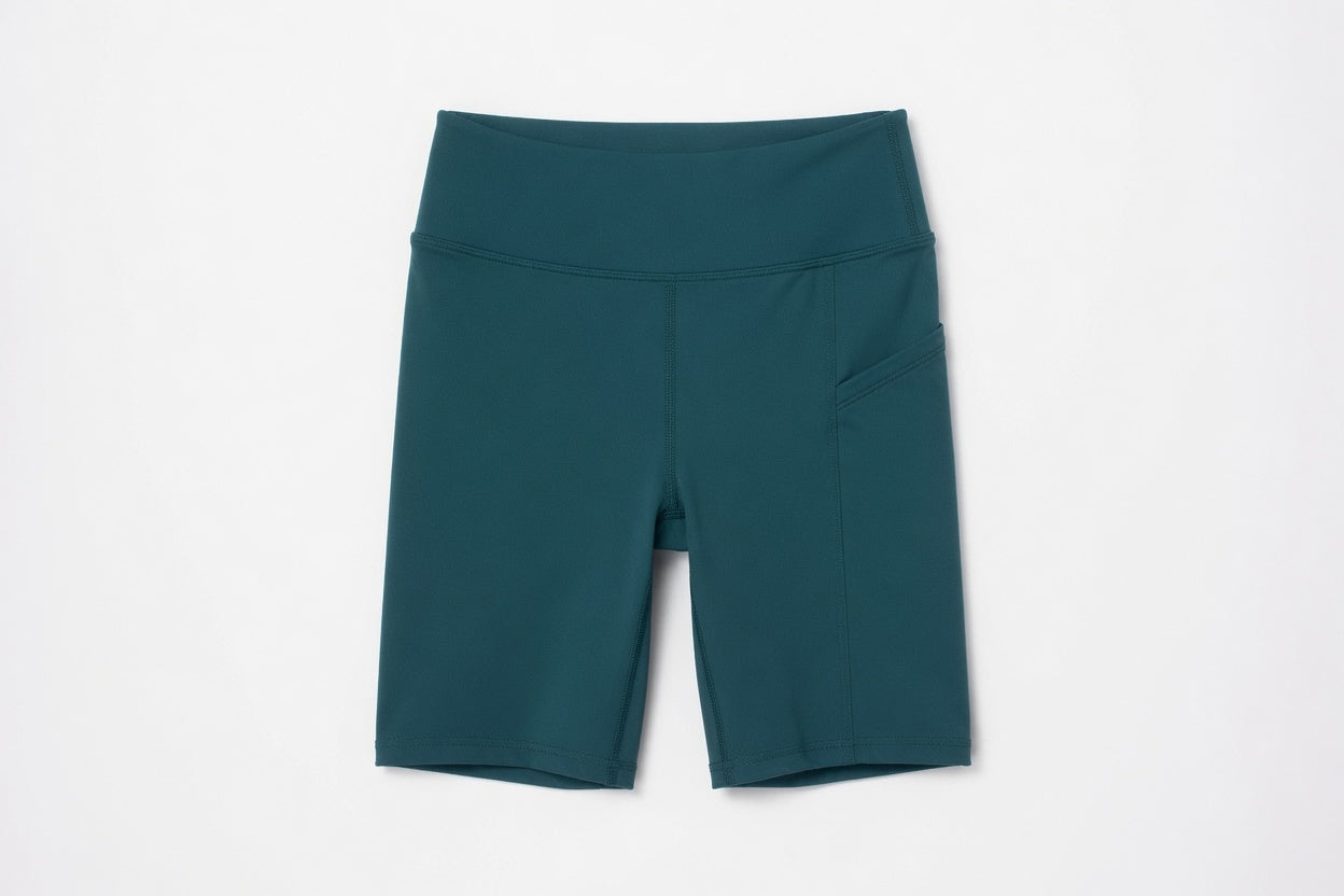 New York Laundry Women's 7-Inch High-Waisted Biker Shorts with Side Pockets, Teal / Dark Green